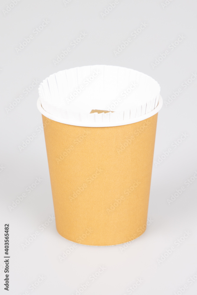 Disposable paper coffee takeout hot drinks cup in ecology concept Disposable paper coffee takeout hot drinks cup in ecology concept