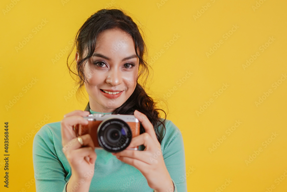 woman photographer with digital camera. tourist holing camera and ready to press the shutter to capture the photo.