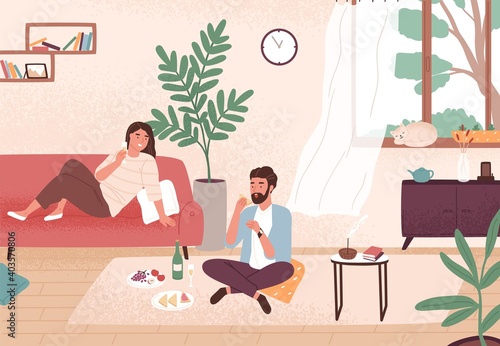 Couple enjoy romantic date at home vector flat illustration. Man and woman having dinner with champagne and snack. Male and female sitting on floor and couch. Enamored pair spending time together