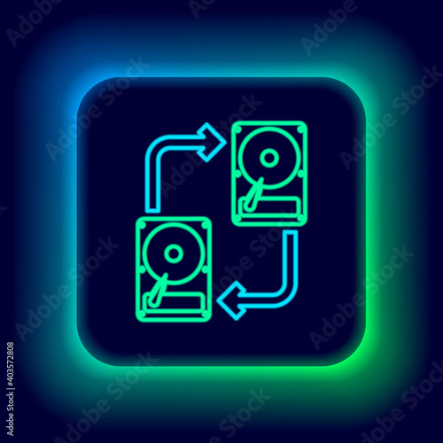 Glowing neon line A fixed data storage device hard disk with arrows, data copy icon isolated on black background. Data exchange with hard disk drive. Colorful outline concept. Vector.