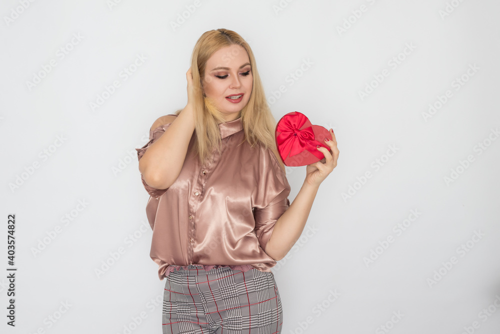 dreaming woman in pink blouse holding red gift box heart dreaming woman in pink blouse holding red gift box heart