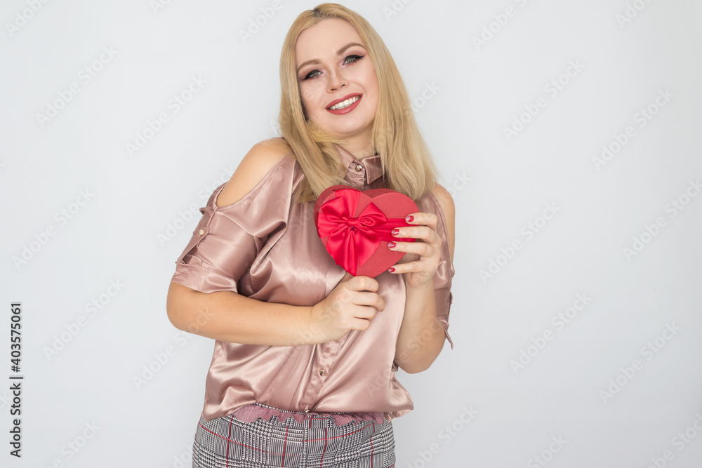 dreaming woman in pink blouse holding red gift box heart dreaming woman in pink blouse holding red gift box heart