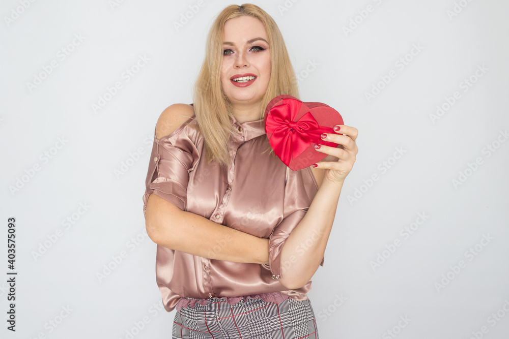 dreaming woman in pink blouse holding red gift box heart dreaming woman in pink blouse holding red gift box heart