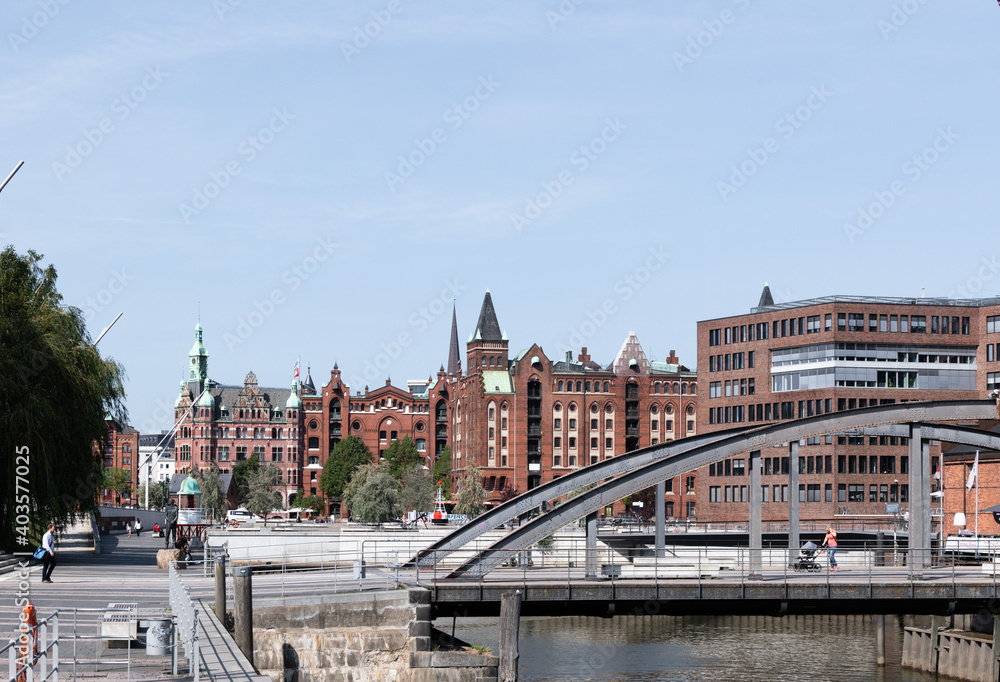 Fototapeta premium The historic Speicherstadt in Hamburg made out of Brick buildings with blue sky.