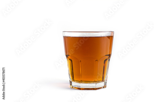 Apple juice in glass on a white background.