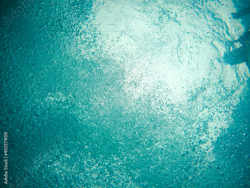 Underwater shot of air bubbles in clear water in a pool