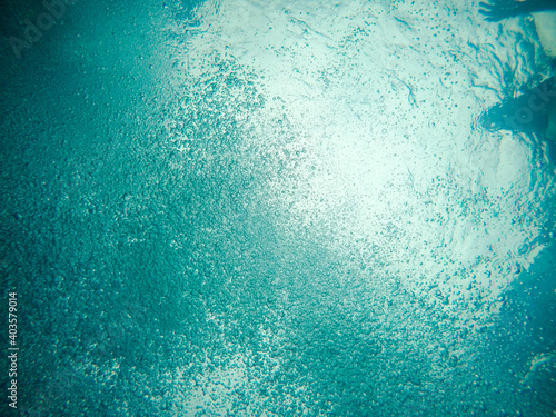 Underwater shot of air bubbles in clear water in a pool