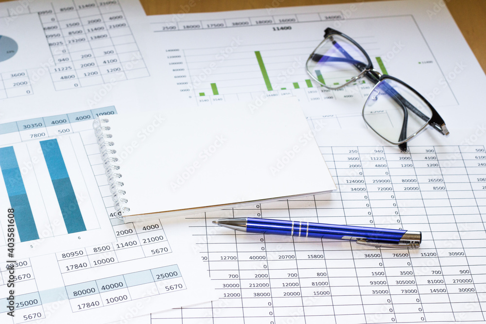 Notepad with pencil and office tools. BUSINESS and finance concept. Notepad with pencil and office tools. BUSINESS and finance concept.