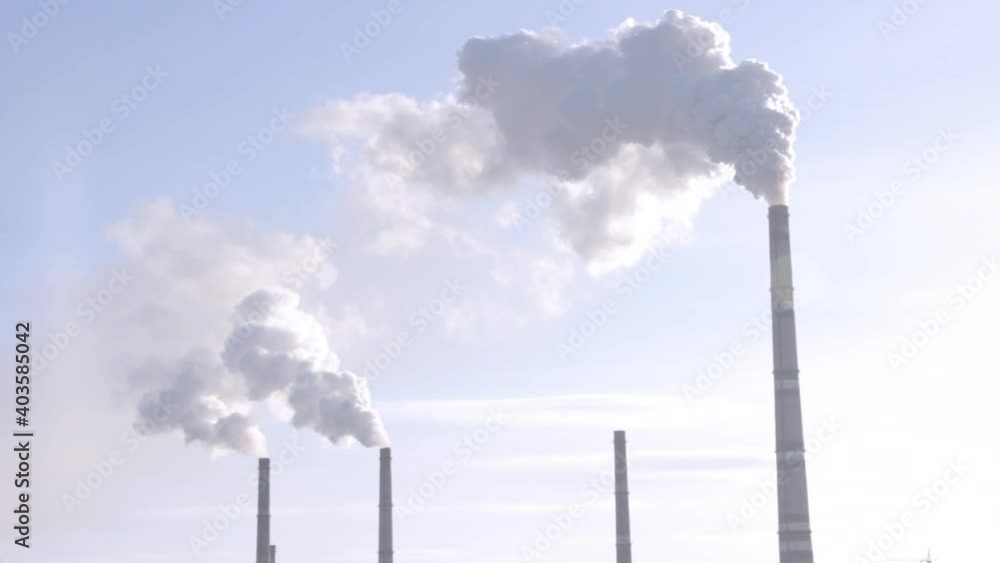 thick clouds of smoke coming from the factory chimneys into the sky thick clouds of smoke coming from the factory chimneys into the sky