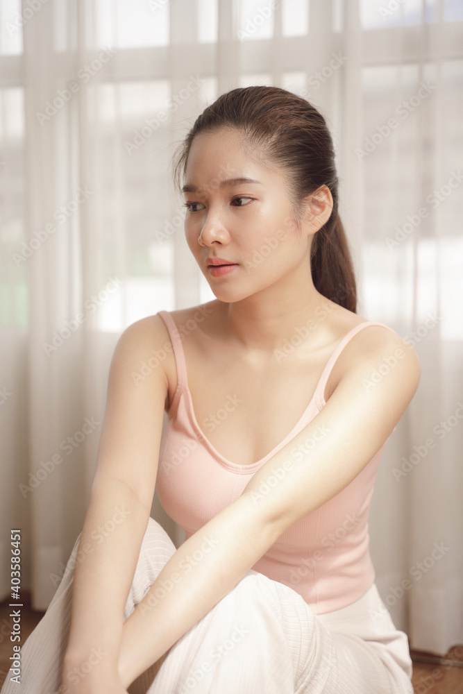 Portrait of young asian beauty woman in pink shirt in white room. Portrait of young asian beauty woman in pink shirt in white room.