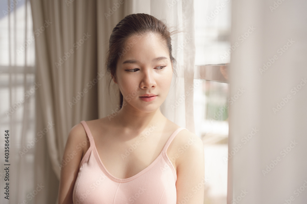 Portrait of young asian beauty woman in pink shirt in white room. Portrait of young asian beauty woman in pink shirt in white room.