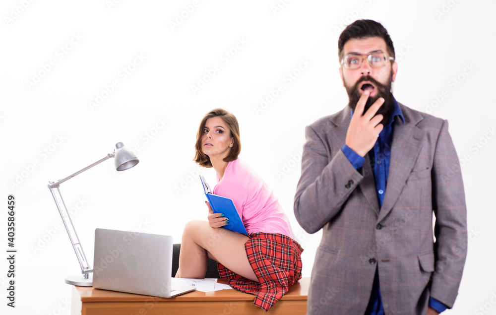 Obraz premium Office manager or secretary. Sexy lady office worker. Sexy personal secretary. Full of desire. Having crush at work boost sexual desire. Bearded boss stand in front of sexy girl working laptop