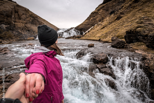 Follow me to the waterfall Glymur with girl in Iceland