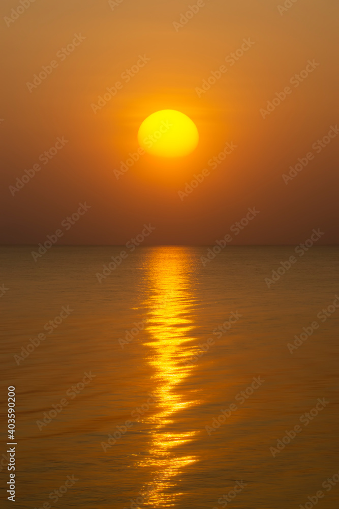 Sunset at the lake with reflection light on water surface.