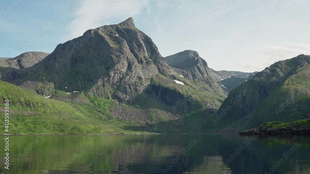Rocky Mountain Range By The Peaceful Lake During Summer Time In Norway. - Static Shot - Seiland Rocky Mountain Range By The Peaceful Lake During Summer Time In Norway. - Static Shot - Seiland