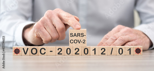 Variant of SARS-CoV-2: VOC-202012/01 on wooden cubes photo