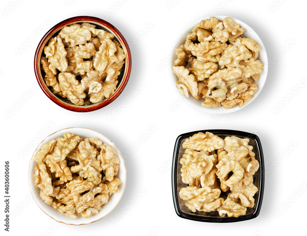Peeled walnut kernels in a bowl. Isolated on a white background. Set Peeled walnut kernels in a bowl. Isolated on a white background. Set