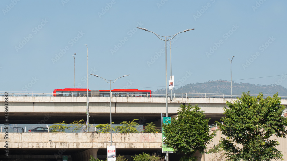  A metro bus is passing by the road near blue area islamabd.jpg