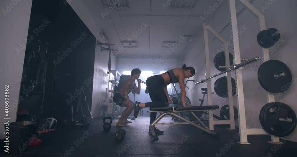 Athletes In Gym With Dumbbells And Barbell Athletes In Gym With Dumbbells And Barbell