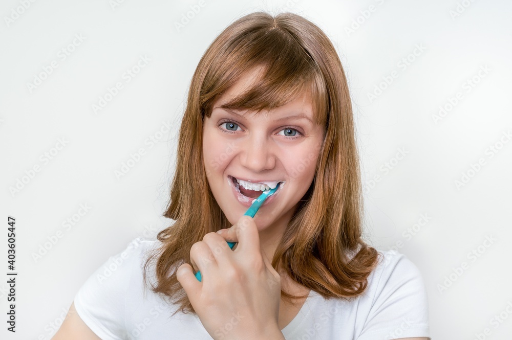 Woman brushing her teeth with toothbrush in the morning Woman brushing her teeth with toothbrush in the morning