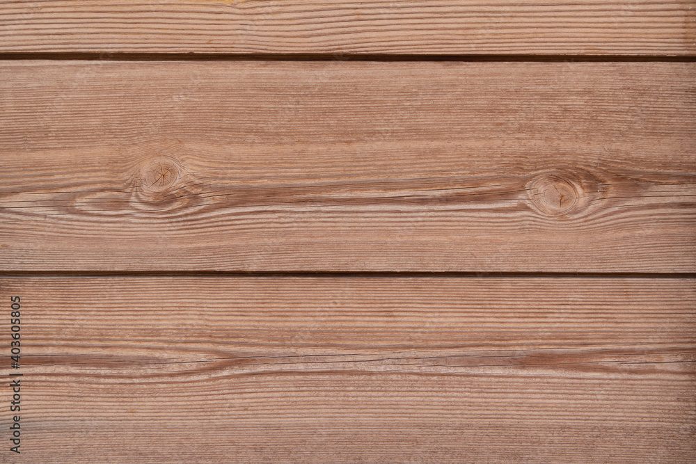 Fototapeta premium Brown wooden texture background with space for text. Top view of natural tree plank. Grunge wooden background. The surface of the new brown wood. Vintage rustic style. Wooden tiles pattern