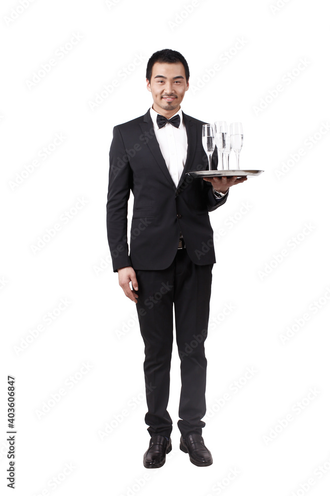 A young waiter carrying wine bottle and glasses A young waiter carrying wine bottle and glasses