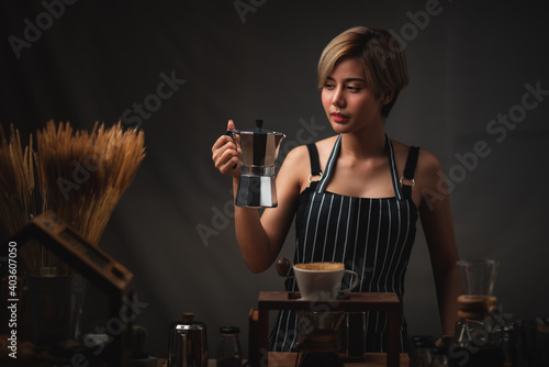 Asian barista girl making c...