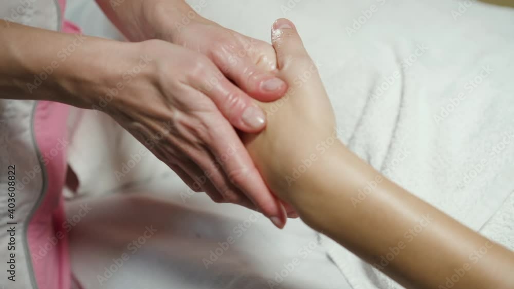 Close up of relaxing wrist massage in a treatment room. Close up of relaxing wrist massage in a treatment room.
