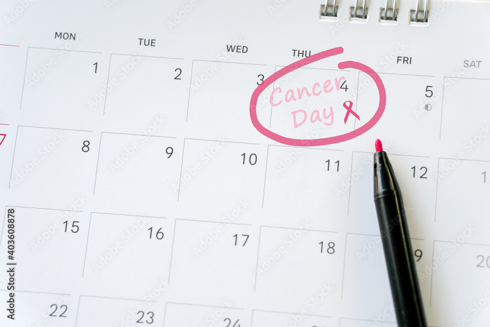 Cancer day concept : breast cancer and calendar Cancer day concept : breast cancer and calendar