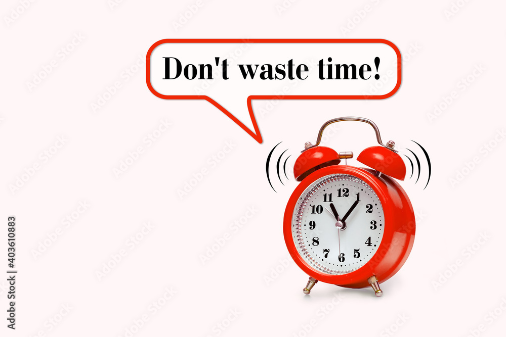 Red alarm clock and text - Don't waste time Red alarm clock and text - Don't waste time