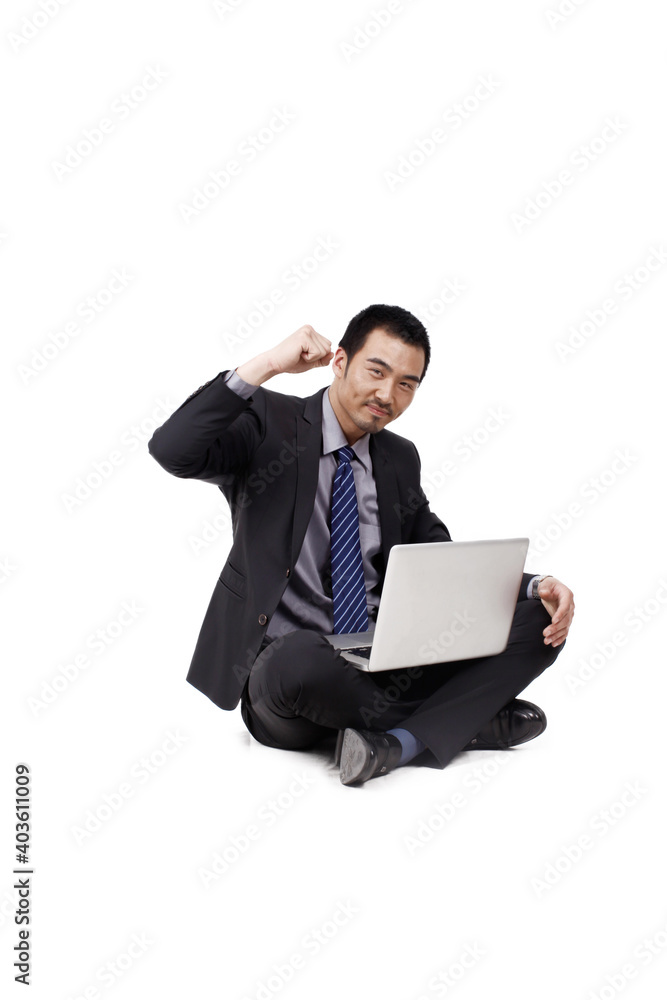 A happy young Business man using laptop A happy young Business man using laptop