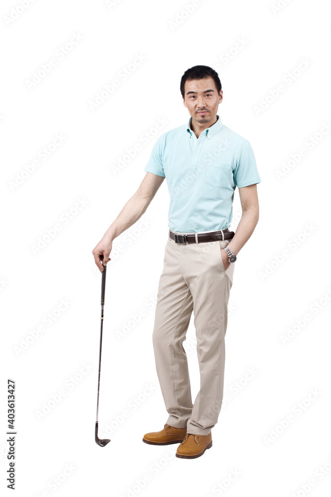 Young man wearing a suit and golfing Young man wearing a suit and golfing