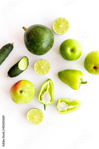 Green vegetables and fruits background. Vegetarians meal, top view