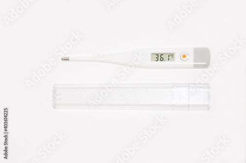 electronic white thermometer shows the temperature of a healthy person who is not sick or recovering pandemic coronovirus pneumonia medicine