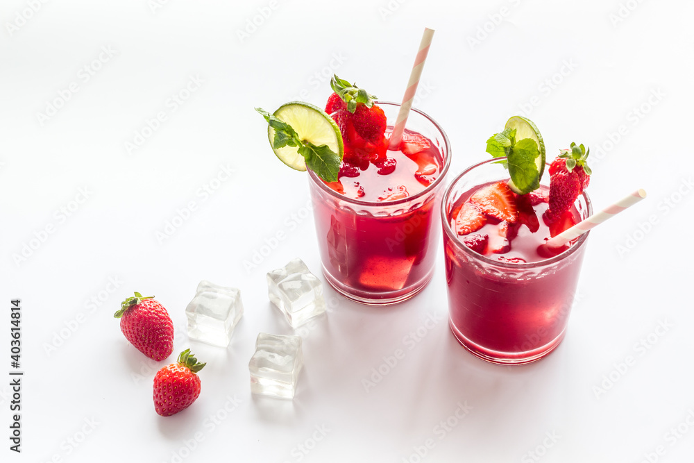 Strawberry cocktail or lemonade with ice and mint. Cold red drink Strawberry cocktail or lemonade with ice and mint. Cold red drink
