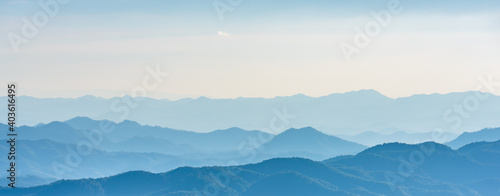 Landscape of mountains range with morning frog for mountain background. © torjrtrx