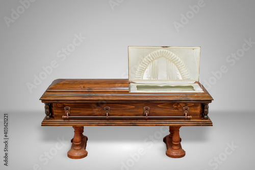 luxury wood coffin on a grey set