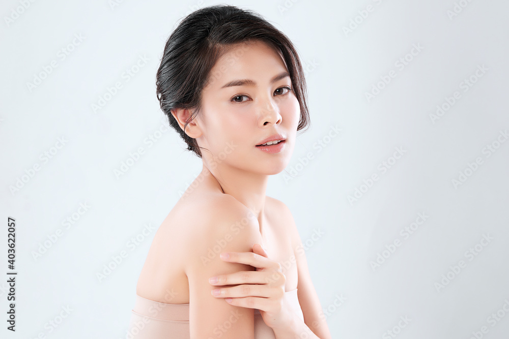 Beautiful Young asian Woman with Clean Fresh Skin, on Pink background, Face care, Facial treatment. Cosmetology, beauty and spa. Asian women portrait Beautiful Young asian Woman with Clean Fresh Skin, on Pink background, Face care, Facial treatment. Cosmetology, beauty and spa. Asian women portrait
