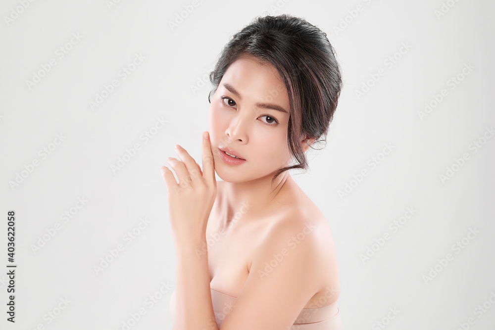 Beautiful Young asian Woman with Clean Fresh Skin, on Pink background, Face care, Facial treatment. Cosmetology, beauty and spa. Asian women portrait Beautiful Young asian Woman with Clean Fresh Skin, on Pink background, Face care, Facial treatment. Cosmetology, beauty and spa. Asian women portrait