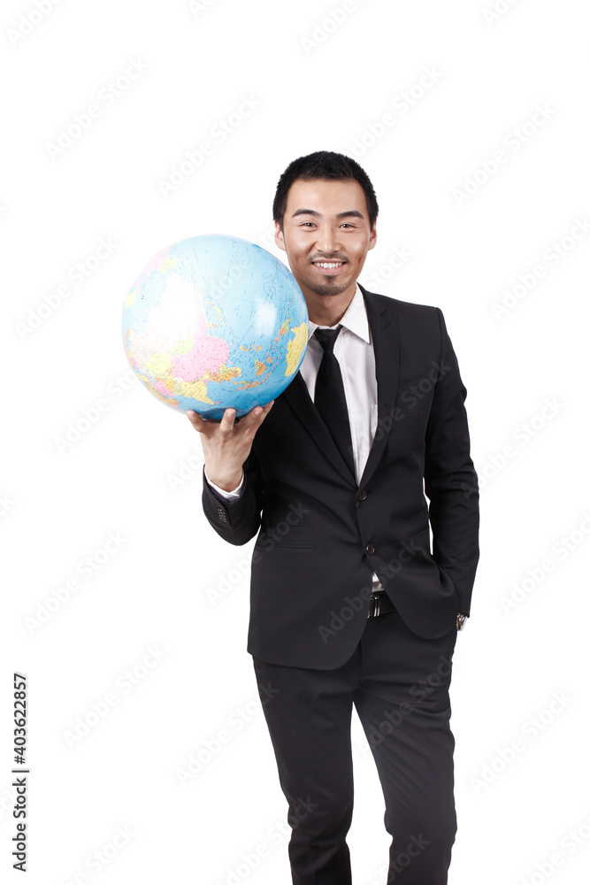 A young business man holding terrestrial globe A young business man holding terrestrial globe