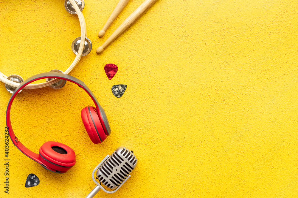 Top view of musical instrument with eadphones, flat design background