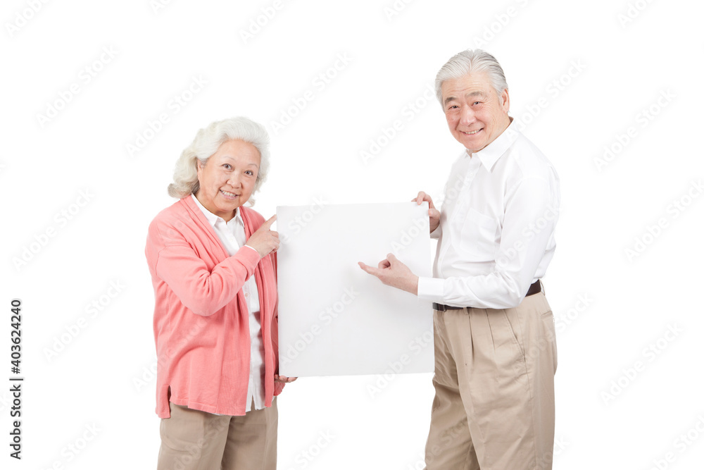 An old senior couple holding white board An old senior couple holding white board