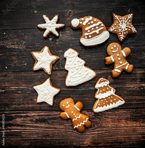 Christmas homemade gingerbread cookie on the wooden background