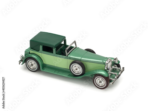 Metal car of yesteryear on white background. Duesenberg model J, 1930