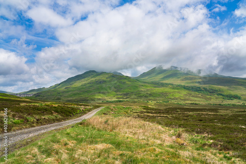 The cloud covered mountain summits of Sron Dha Mhurchaidh, Beinn Ghlas and Meall Corranaich that surround Ben Lawers nature reserve near Loch Tay in the Scottish Highlands, UK. photo