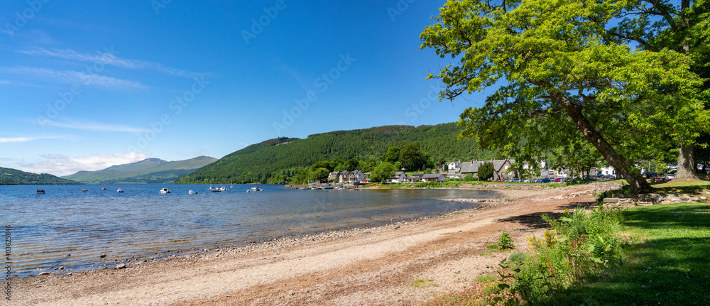 The shore of Loch Rannoch at Kinloch Rannoch near Taymouth on a sunny day in the Scottish Highlands, UK.