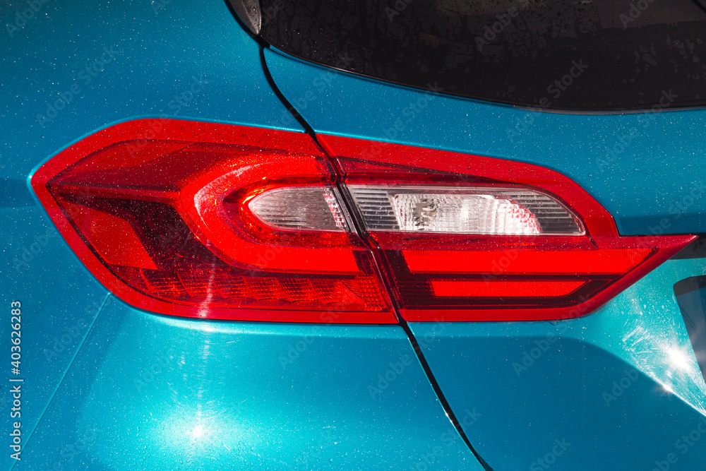 Close-up  car rear tail-lamp with a brakelight stop signal.