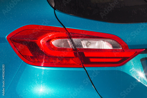 Close-up  car rear tail-lamp with a brakelight stop signal. photo