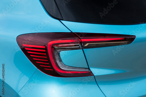 Close-up  car rear tail-lamp with a brakelight stop signal. photo