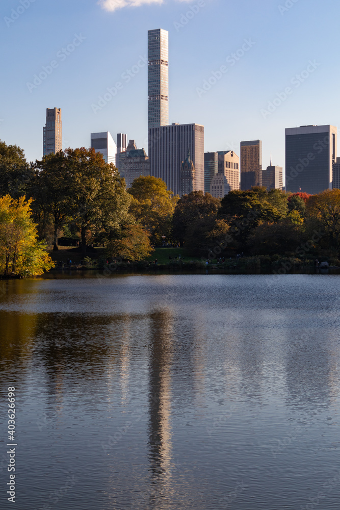 The Lake at Central Park with Colorful Trees during Autumn and the Midtown Manhattan Skyline of New York City